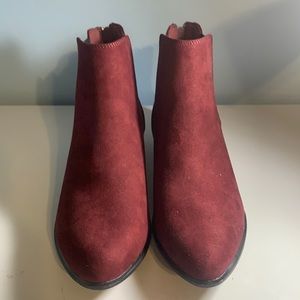 Maroon ankle boots with the zippers in the back.